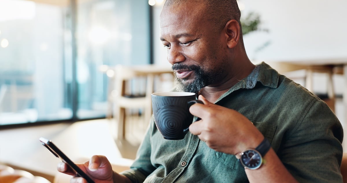 An older man drinks coffee in his home, representing the growing population of solo agers. 